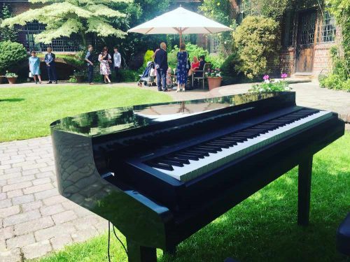 Portable electric baby grand piano