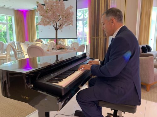 Pianist at the Grove Watford with a portable electric baby grand piano